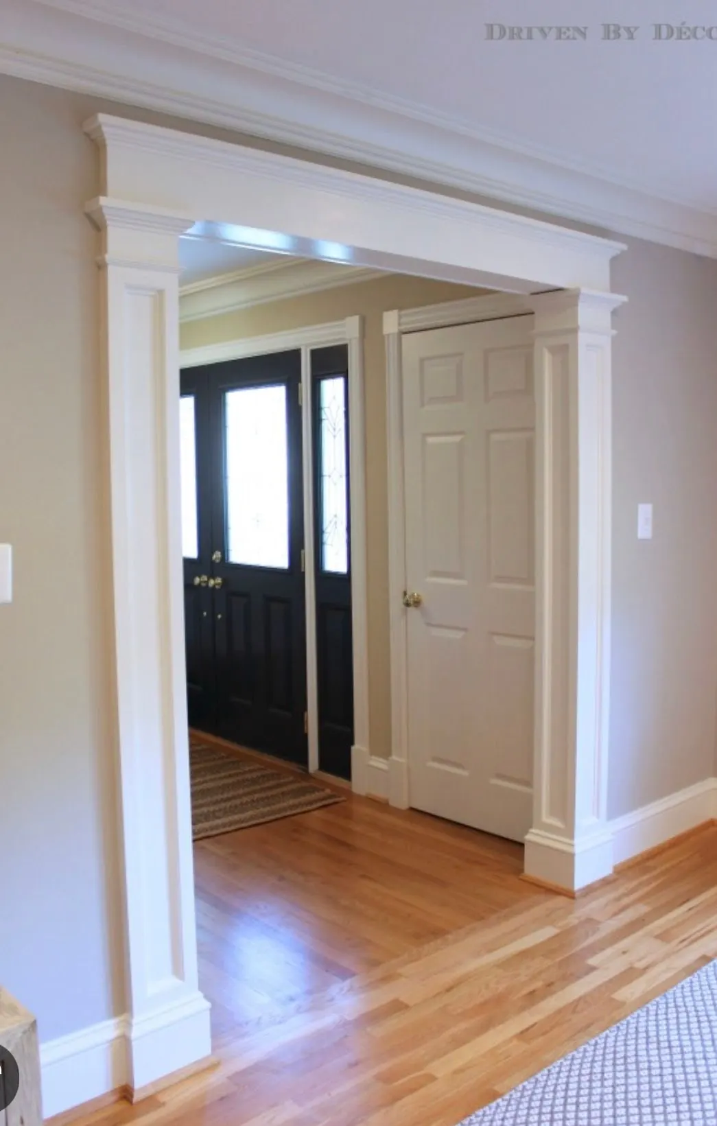 Doorway trimmed with pilasters and a built-up header